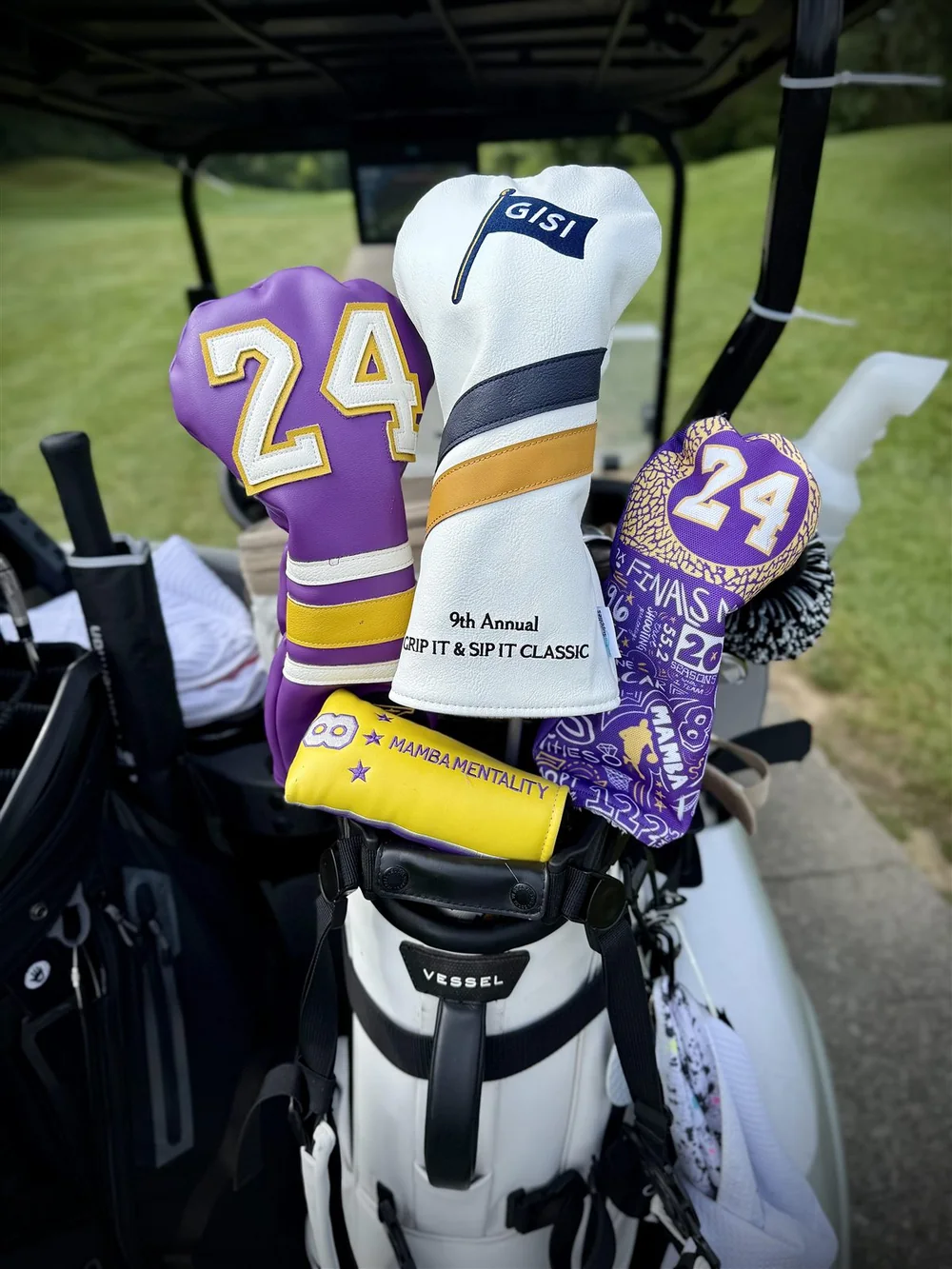 Custom headcovers for the Grip It and Sip It Classic in a golf bag on a cart