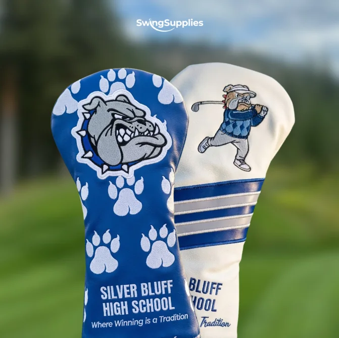 A blue headcover with a bulldog and paw prints and a white cover with a golfer, for Silver Bluff High School